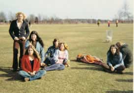 Friends relaxing on the grass at Jones Beach